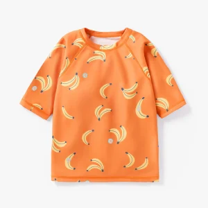 T-shirt de bain orange à motifs de bananes, enfant || Cream rashguard with banana all over print, ch