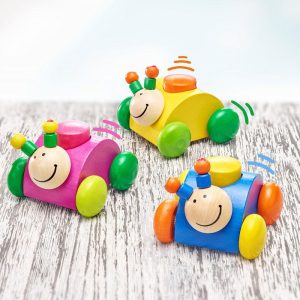 Rollina, la coccinelle en bois roulante - différents coloris - à partir de 6 mois